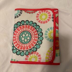 Bold floral design note pad holder.